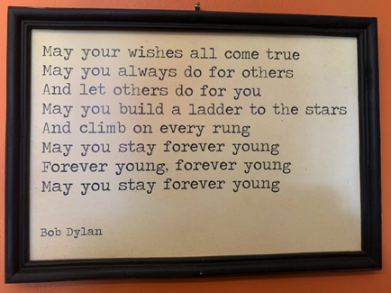 Apr 22 - Framed and hanging on the wall of Grotto Cafe, "Forever Young"